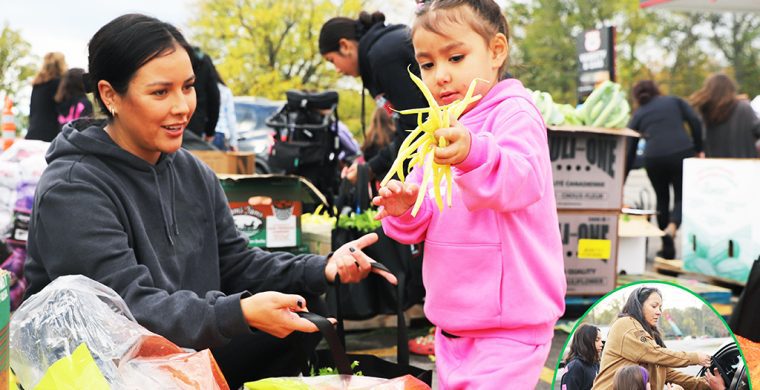 It’s all about family. Route 54 Variety owner Kris Hill’s annual Harvest food give-away fed over 700 families. Volunteers and family, like daughter Markie Styres and her four-year-old daughter Willow, filled bags of food placed in cars by Kris Hill and two more granddaughters. (Photo by Jim C. Powless)