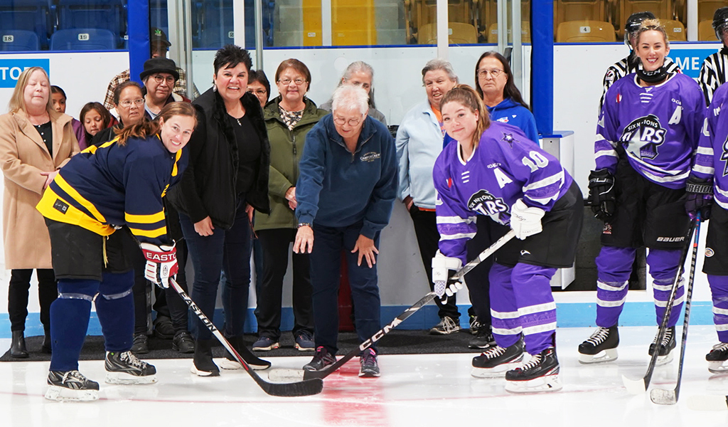 Former local hockey star Helen Lickers drops the ceremonial puck at the Six Nations Stars’ home opener this Friday. The pre-game ceremony included Six Nations Chief Sherri-Lyn Hill on her left.