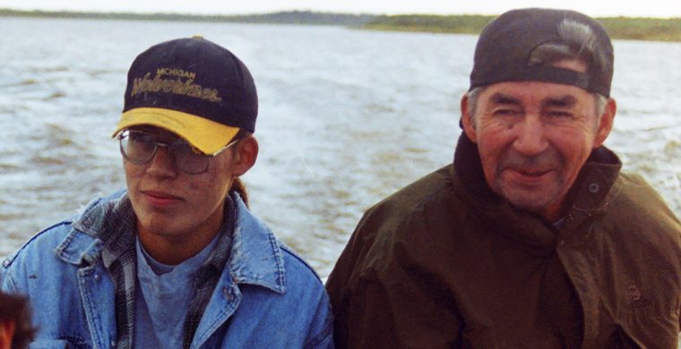 Xavier Kataquapit with his father Marius Kataquapit in their family freighter canoe in the fall of 1996 at the mouth of the Attawapiskat River on James Bay. Photo provided by X Kataquapit.