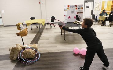 Wrangling the cow. The Six Nations Farmers’ Association had a room full of fun hands on displays at their annual Agricultural Day Friday, including how to wrangle cattle! See page 4 for more. (Photo by Jim C Powless)