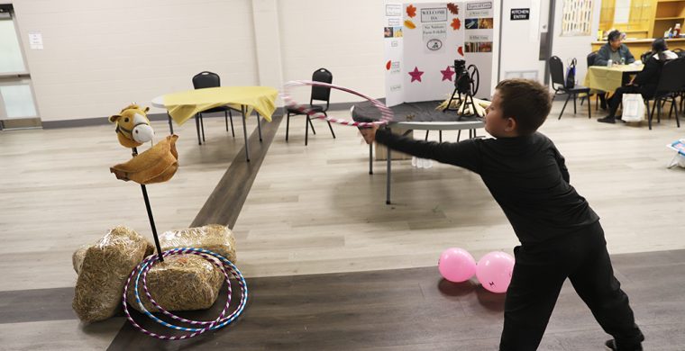 Wrangling the cow. The Six Nations Farmers’ Association had a room full of fun hands on displays at their annual Agricultural Day Friday, including how to wrangle cattle! See page 4 for more. (Photo by Jim C Powless)