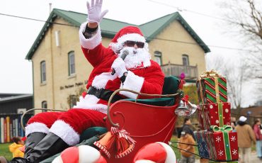 Leading a parade of floats, Santa Claus arrived at Six Nations Saturday and made his way through Ohsweken. (Photo by Jim C Powless)