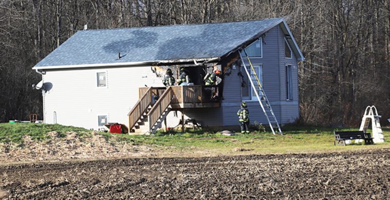 Six Nations Firefighters responded to a blaze at a house at 1621 Fifth Line Saturday Nov. 22. The fire started on the deck. Damage estimates were not available at press time. There were no injuries and Six Nations Fire Chief Mike Seth said the cause is under investigation. (Photo by Jim C Powless)