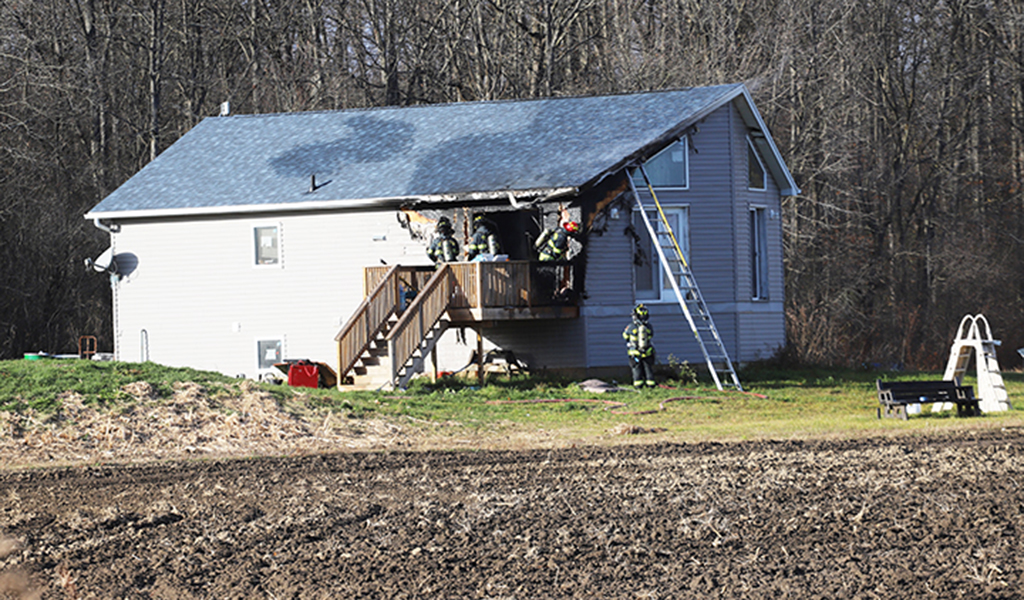 Six Nations Firefighters responded to a blaze at a house at 1621 Fifth Line Saturday Nov. 22. The fire started on the deck. Damage estimates were not available at press time. There were no injuries and Six Nations Fire Chief Mike Seth said the cause is under investigation. (Photo by Jim C Powless)