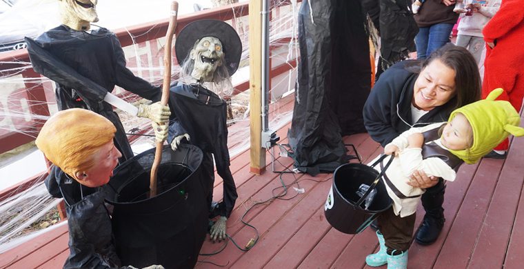 Forget the witches, U.S. President Trump appearing at Turtle Island News’ annual Haunted Porch was enough to startle this little one back into mom’s arms!