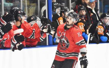 Todd Ratchford (#19) celebrates a goal with his Six Nations Ironmen teammates in their Dec. 21 game. Photo by Honee Anderson.