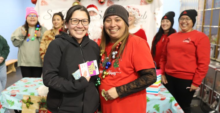 A $9,000 winning smile! The Six Nations Skating club was the big winner in their 50-50 draw held over the holidays raising over $18,000. But the largest smiles came when club president Rhonda Skye gave the biggest ticket seller Artie Martin and his wife Shyla (pictured) a nice $9.067.57 holiday prize! His wife Shyla accepted the prize. (Photo by Jim C. Powless)