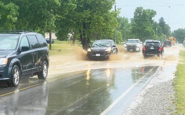 June 2025 floods hit roadways, fields, homes and buildings in the community. (Photo by Jim C. Powless)
