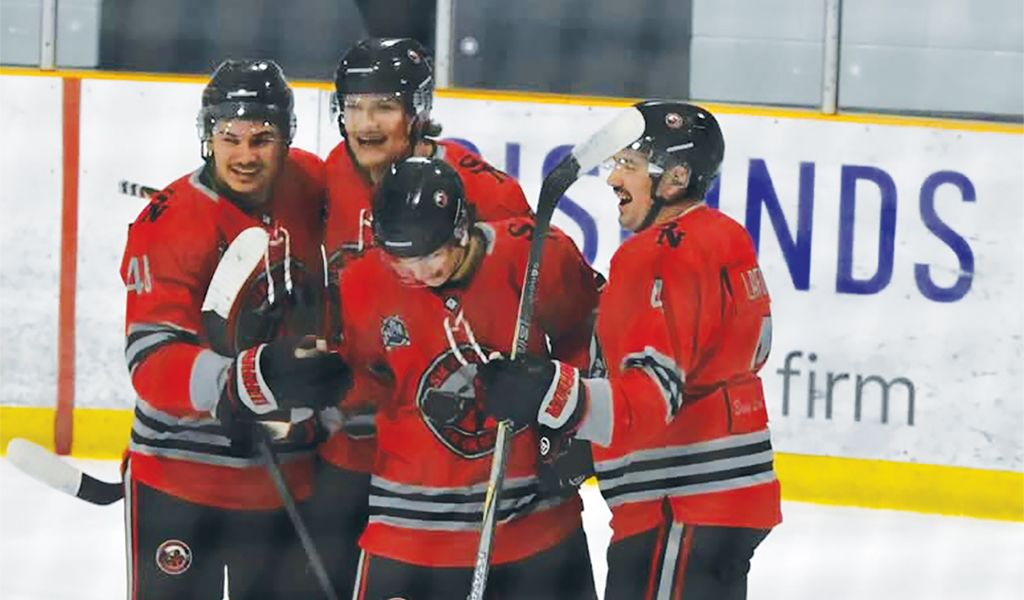 Members of the Six Nations Ironmen celebrate a goal from their Friday game in Strathroy. Photo by Honee Anderson.