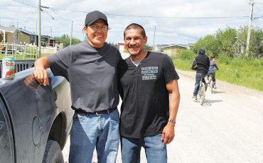Xavier Kataquapit with his childhood friend and cousin Joey Okimaw at their home community of Attawapiskat First Nation in 2016. (Photo by Xavier Kataquapit)