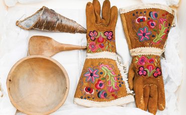 A bowl and spoon from the Manitoulin Island region, and embroidered gloves from Athabasca Chipewyan First Nation, right, are among the first items traced to a living relative, out of 62 Indigenous items returned to Canada by the Vatican in 2024. (Photo by THE CANADIAN PRESS/Spencer Colby)