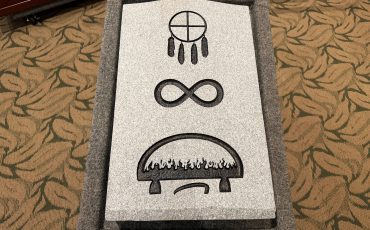 A headstone featuring a traditional Inuit lamp is seen in this undated photo. The lamp has been approved as an optional spiritual emblem for headstones at the National Military Cemetery. The qulliq emblem was unveiled in a ceremony at Beechwood Cemetery in Ottawa on May 19, 2026. THE CANADIAN PRESS/Handout - Beechwood Cemetery Foundation (Mandatory Credit)
