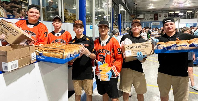 Six Nations Lacrosse Rebels youth team came to volunteer at this year’s Bread and Cheese armed with smiles and bread and cheese. (Photo by Alex Murray)