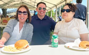 Six Nations band councillors Cynthia Jamieson, Dean Hill and Hazel Johnson took a minute to enjoy the SNEC barbecue after serving up pulled pork sandwiches for the crowd.. (Photos by Alex Murray)