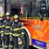 Calvin Thomas and trainees Evan Gibson, Matt Scanlin, and Sophia Xhekaj stand next to one of the newest additions to SNF’s fleet.