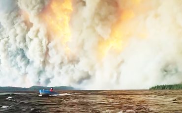 Collins First Nation was forced to flee massive wildfires destroying the north by boats. (Photo by Lynden Tyler)