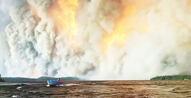 Collins First Nation was forced to flee massive wildfires destroying the north by boats. (Photo by Lynden Tyler)