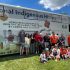 Artist Corrie Hill and her extended family posed in front of the Metrolinx bus featuring her work. (Photo by Alex Murray)