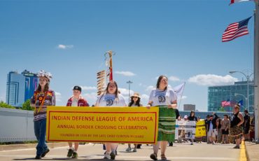 Over 100 people took to the Rainbow Bridge this past weekend to mark 99 years of Haudenosaunee border crossing rights. The 1794 Jay Treaty between the United States and Great Britain marks Indigenous rights to freely cross their international border. (Supplied Photo)
