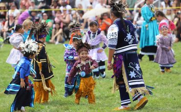 The sun may have been shining on this year’s Champion of Champions Pow Wow, but it was the tiny tot dancers that brought out the smiles! (Photo by Jim C. Powless)