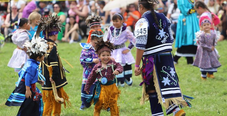 The sun may have been shining on this year’s Champion of Champions Pow Wow, but it was the tiny tot dancers that brought out the smiles! (Photo by Jim C. Powless)