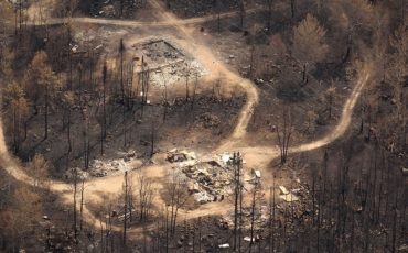 Wildfire damage is pictured from the air in Collins First Nation, a small, remote Ojibwa community located in northwestern Ontario, about 250 km north of Thunder Bay, Ont., on Wednesday, July 22, 2026. (THE CANADIAN PRESS/Chris Young)