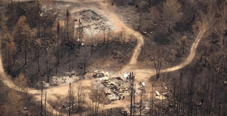 Wildfire damage is pictured from the air in Collins First Nation, a small, remote Ojibwa community located in northwestern Ontario, about 250 km north of Thunder Bay, Ont., on Wednesday, July 22, 2026. (THE CANADIAN PRESS/Chris Young)
