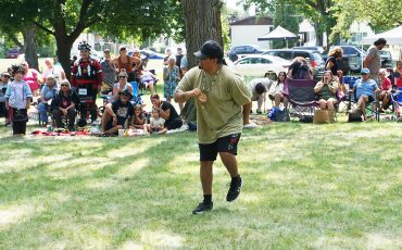 Ah.... when the music just moves you! A member of the drum group jumped up and let the music move him while the crowd was surprised and delighted in his fun at Woodland Cultural Centre’s annual Smoke Dance Competition Saturday, August 15th. (Photo by Jim C. Powless. More page 5)