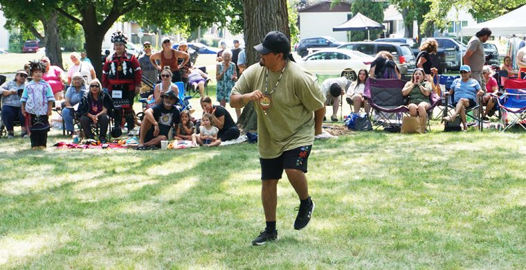 Ah.... when the music just moves you! A member of the drum group jumped up and let the music move him while the crowd was surprised and delighted in his fun at Woodland Cultural Centre’s annual Smoke Dance Competition Saturday, August 15th. (Photo by Jim C. Powless. More page 5)