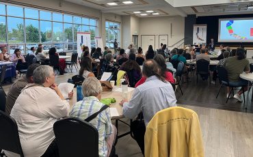 A crowd packed the Six Nations community hall to hear details of the coming land rights court battle. (Photos by Alex Murray)