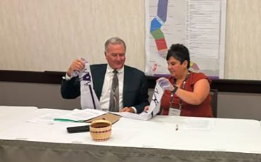 Brantford Mayor Kevin Davis and Six Nations Elected Chief Sherri-Lyn Hill signed a MOU over future land development at the Association of Municipalities of Ontario (AMO) conference in Ottawa where Elected Chief Hill presented Mayor Davis with a gift depicting the Two Row Wampum Treaty. (Supplied Photo)