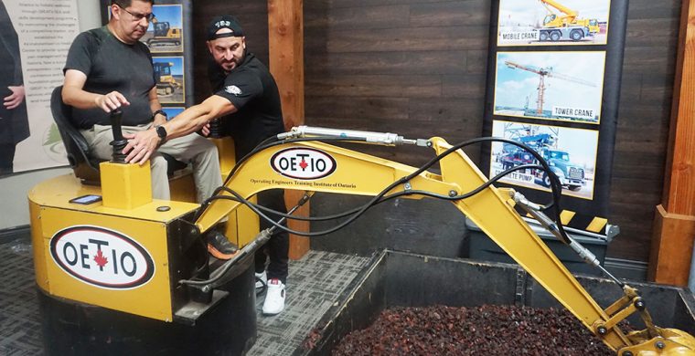 Turtle Island News’ own photographer, Jim Powless decided to try out some heavy equipment with the help of Shane Hill at Grand River Employment and Training’s Job Fair at the Gathering Place last week. The decision...a camera is lighter! (Turtle Island News Photo)