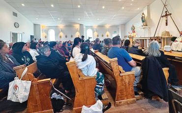 The New St Francis Xavier Church in Attawapiskat FN was opened on August 25, 2026. The community is pictured here during the opening ceremony and consecration of the new church. (Photo by Rosie Koostachin)