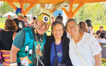 Many First Nations come together at every Pow Wow to celebrate culture and heritage. At the Matachewan FN Annual Pow Wow which ran August 29 and 30 are from L-R: Traditional Dancer George Rose, Attawapiskat FN; Elder Vina Hendrix-Landry, Matachewan FN and Betty Naveau, Mattagami FN. (Photo by Xavier Kataquapit)