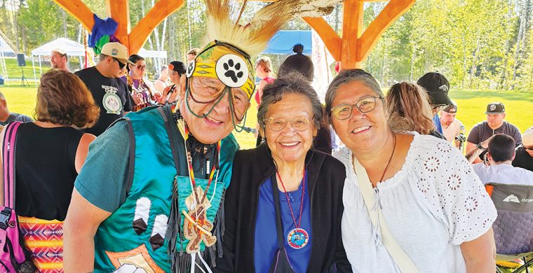 Many First Nations come together at every Pow Wow to celebrate culture and heritage. At the Matachewan FN Annual Pow Wow which ran August 29 and 30 are from L-R: Traditional Dancer George Rose, Attawapiskat FN; Elder Vina Hendrix-Landry, Matachewan FN and Betty Naveau, Mattagami FN. (Photo by Xavier Kataquapit)