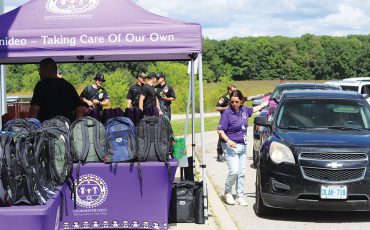 Six Nations Ogwadeni:Deo staff showed the community what taking care of your own looks like Friday, August 8, when, with the help of Six Nations Firefighters, they gave out 200 back packs to parents in a long line of cars at their Back-To-School Drive-Thru Event. (Photo by Jim C. Powless)