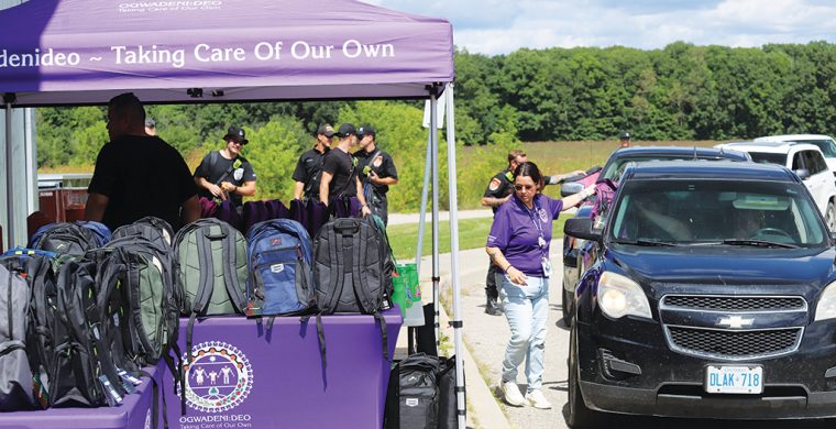 Six Nations Ogwadeni:Deo staff showed the community what taking care of your own looks like Friday, August 8, when, with the help of Six Nations Firefighters, they gave out 200 back packs to parents in a long line of cars at their Back-To-School Drive-Thru Event. (Photo by Jim C. Powless)