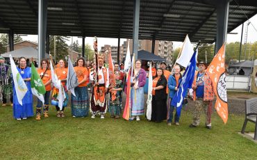 The flag bearers for the grand entry and exit of the Sixth Annual Every Child Matters Pow Wow in Kirkland Lake were from L-R: Sue Alton, Mino M’shki-ki Health Team; Rox-Anne Gaignard, Centre de santé communautaire du Témiskaming; Lori Lalonde, Keepers of the Circle; Marie Claude Patry, EarlyON; Elder George Rose Paulmartin, Head Elder Dancer; Dawson Moore (in front), Every Child Matters flag; Councillor Real Boucher, Matachewan FN; Alexie Polson, Two-Spirit flag; Mayor Stacy Wight, Town of Kirkland Lake; Chief Wayne Wabie, Beaverhouse FN; Tyler Twarowski, Metis Nation of Ontario and Michel Dupuis, representing Veterans flag. (Photo by Xavier Kataquapit)